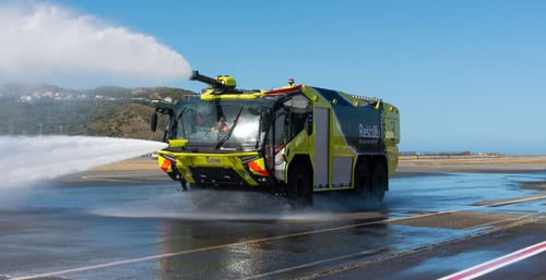 an airport fire rescue truck blowing water
