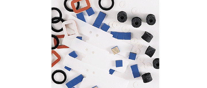 a spread of die-cut plastic and rubber gaskets