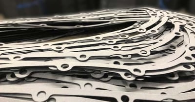 a stack of die cut sealing gaskets