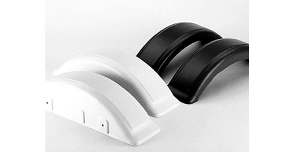 An example of thermoforming. Two white pieces and two black pieces