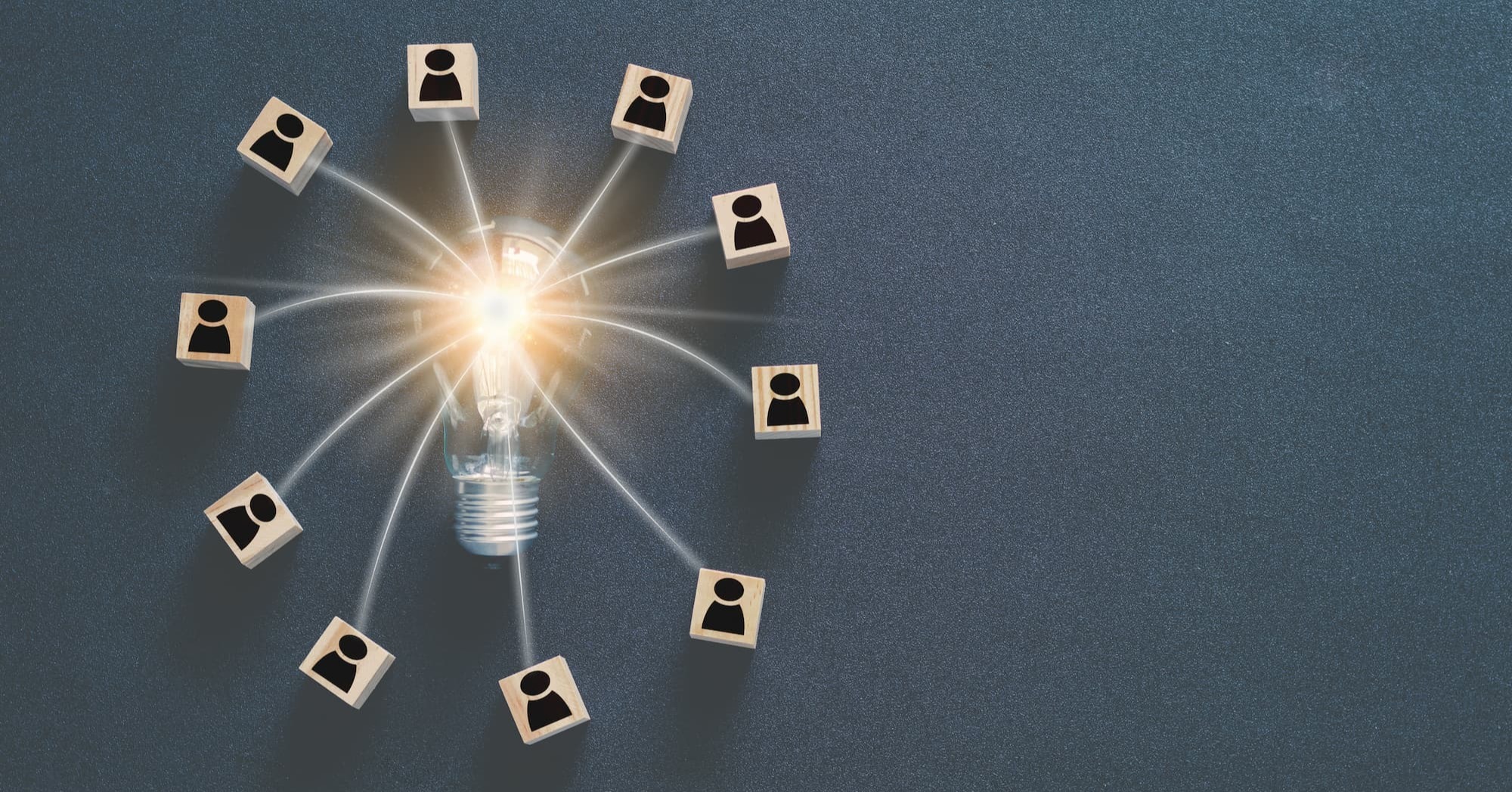 a light bulb with people icons connected to it, representing the everyone working together to brainstorm
