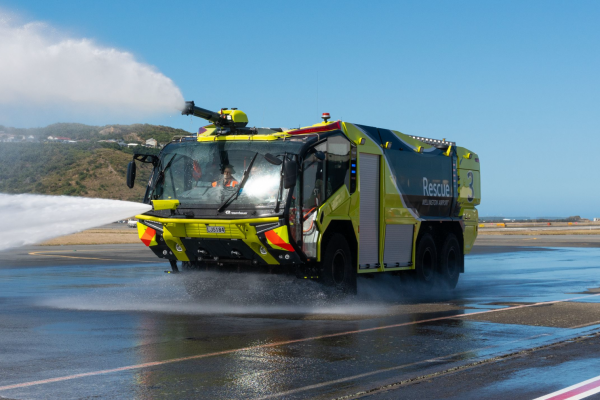 an airport rescue fire truck spraying water