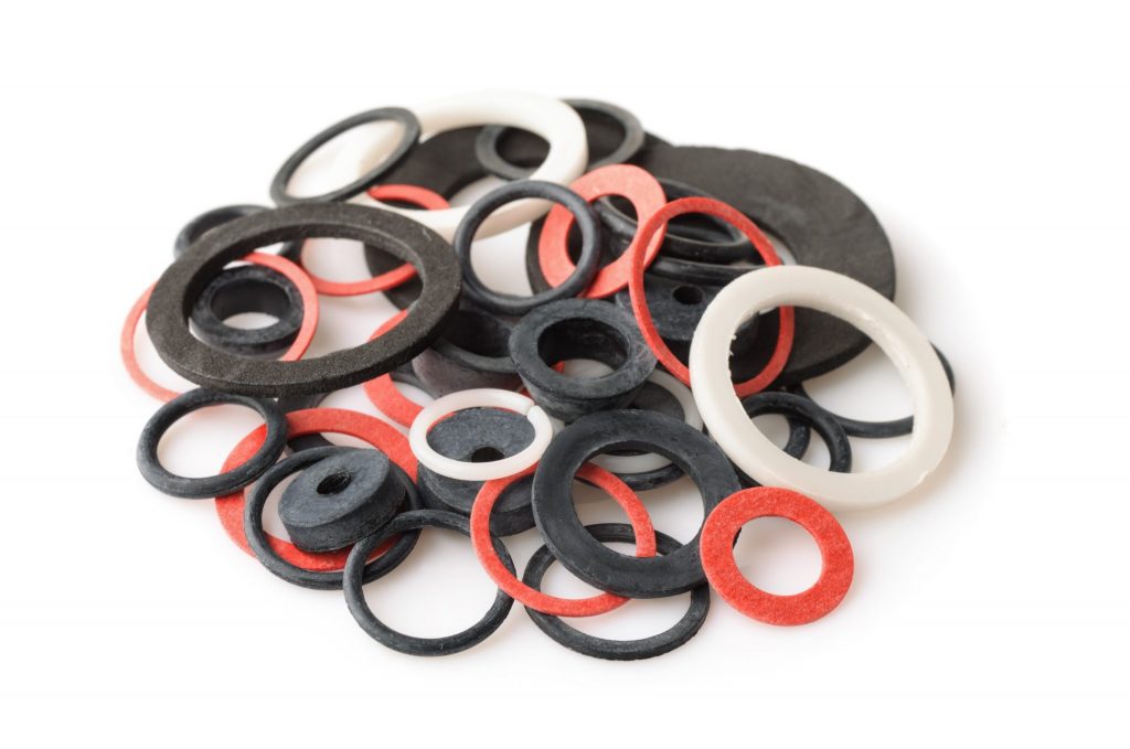 a pile of rubber gaskets and washers